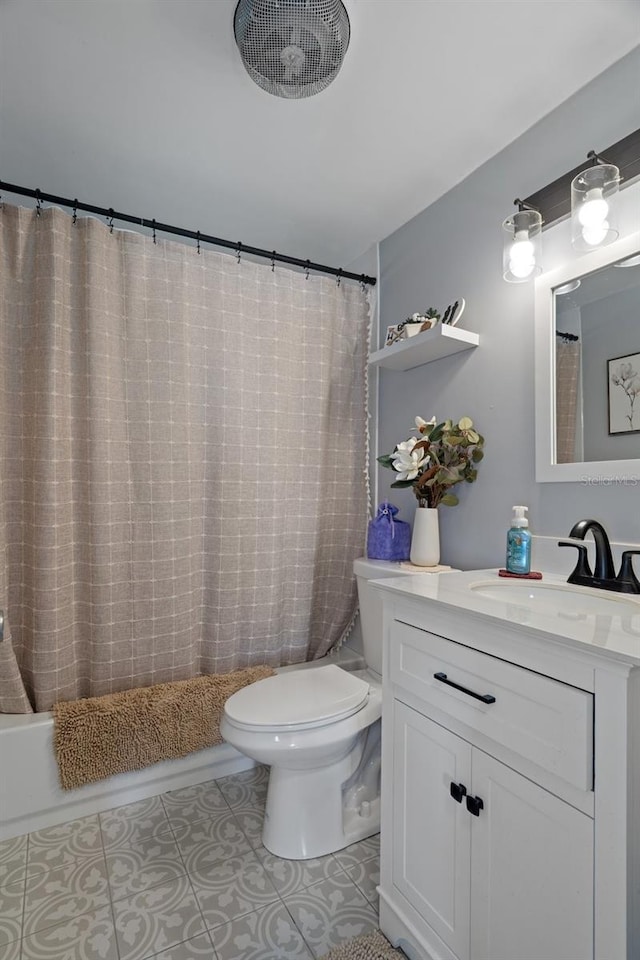 bathroom with shower / bathtub combination with curtain, toilet, vanity, and tile patterned flooring