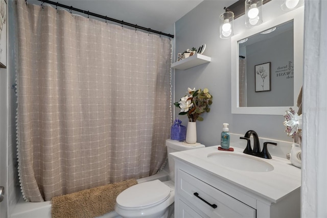 bathroom featuring toilet, vanity, and shower / bath combo