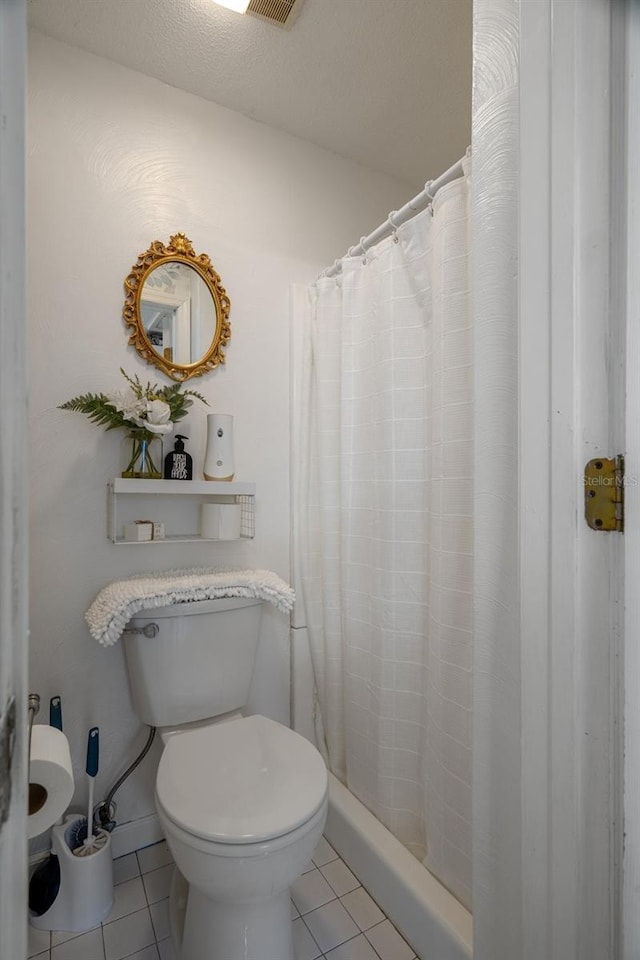 full bath featuring tile patterned floors, visible vents, a stall shower, and toilet