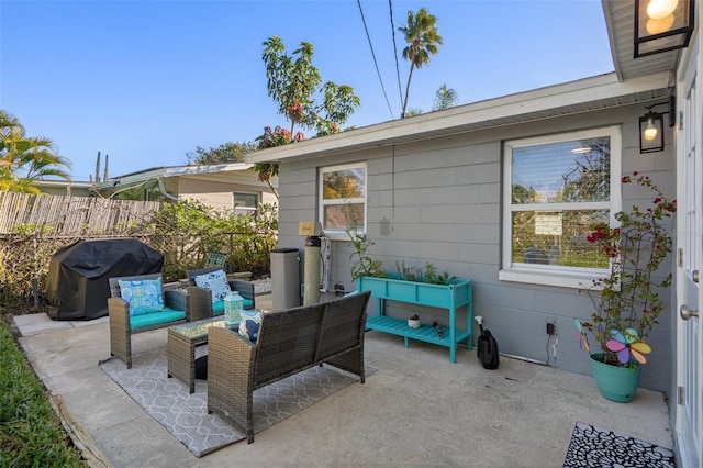 view of patio / terrace with a grill and fence