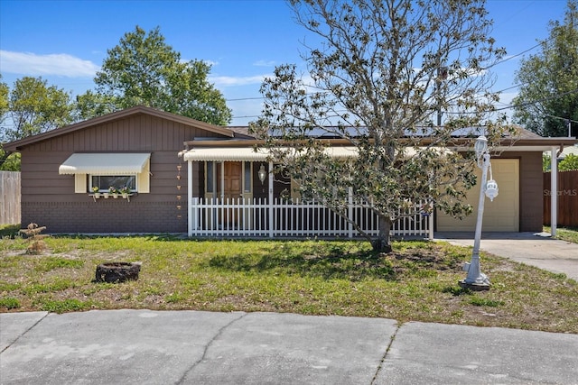 3728 Linkwood St, New Port Richey, FL 34652 - ranch-style home featuring concrete driveway, brick siding, fence, and a garage