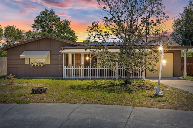 3728 Linkwood St, New Port Richey, FL 34652 - ranch-style home featuring an attached garage, a front lawn, driveway, and brick siding