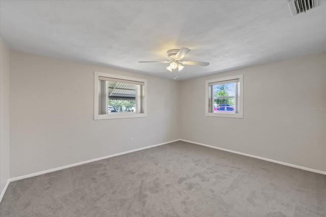 3728 Linkwood St, New Port Richey, FL 34652 - carpeted empty room featuring ceiling fan, baseboards, and visible vents