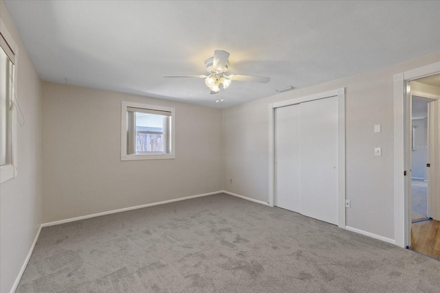 3728 Linkwood St, New Port Richey, FL 34652 - unfurnished bedroom featuring visible vents, baseboards, a ceiling fan, a closet, and carpet floors