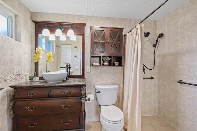 3728 Linkwood St, New Port Richey, FL 34652 - bathroom featuring tile walls, toilet, vanity, and a tile shower