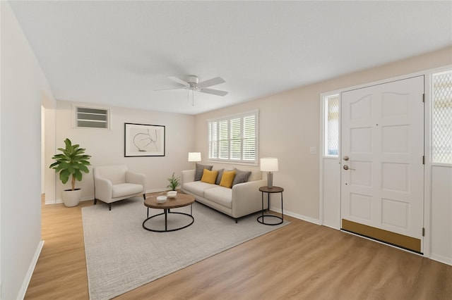 3728 Linkwood St, New Port Richey, FL 34652 - living area featuring light wood finished floors and a ceiling fan
