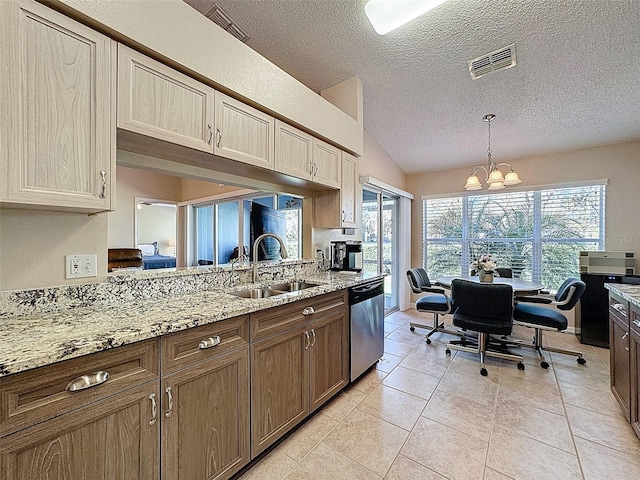 kitchen featuring visible vents, a chandelier, dishwasher, lofted ceiling, and a sink