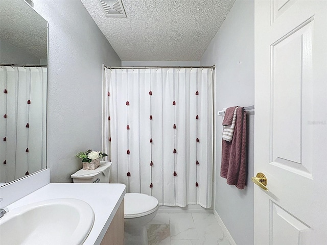 bathroom featuring vanity, visible vents, a textured ceiling, toilet, and marble finish floor