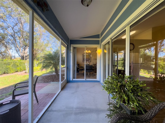 sunroom / solarium with lofted ceiling