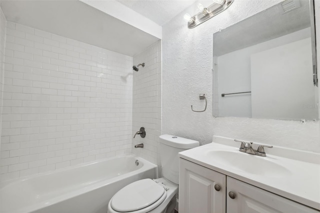 bathroom with visible vents, toilet, bathtub / shower combination, a textured wall, and vanity