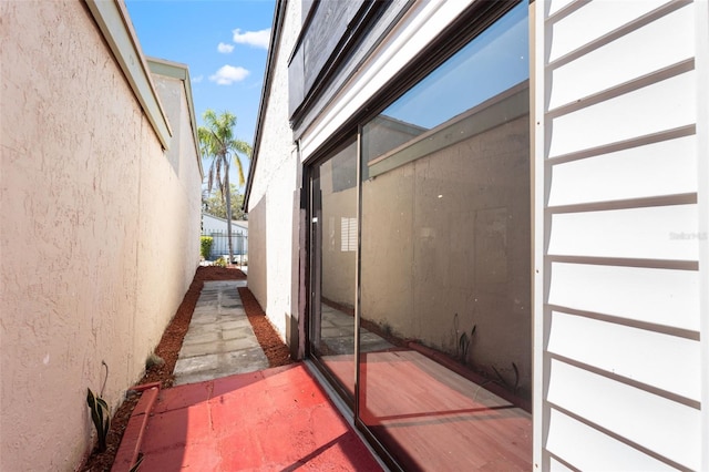 view of side of home with stucco siding