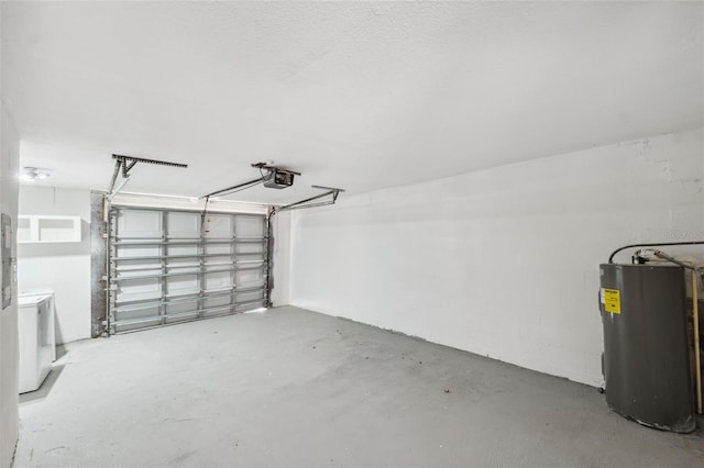 garage with washer / clothes dryer, electric water heater, and a garage door opener