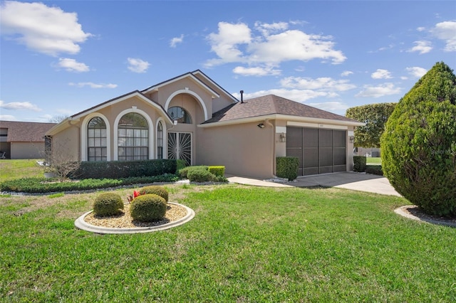 ranch-style house with a front yard, an attached garage, driveway, and stucco siding