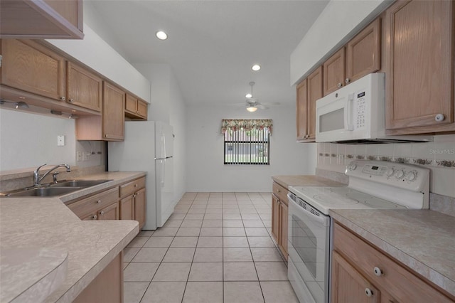 kitchen with white appliances, light tile patterned floors, a ceiling fan, a sink, and light countertops