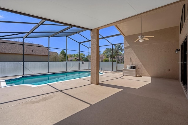 view of swimming pool featuring a ceiling fan, a lanai, a patio area, and a fenced in pool