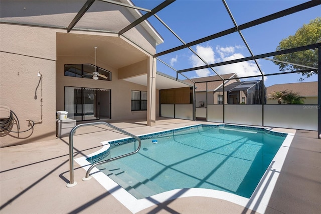 pool with a lanai, a ceiling fan, and a patio area