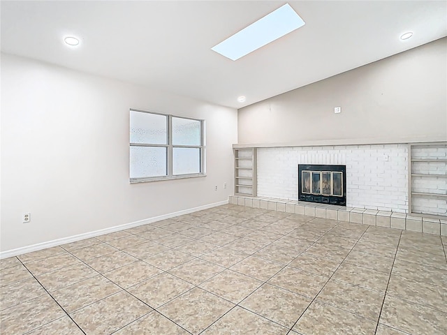 unfurnished living room featuring baseboards, lofted ceiling, recessed lighting, tile patterned floors, and a brick fireplace