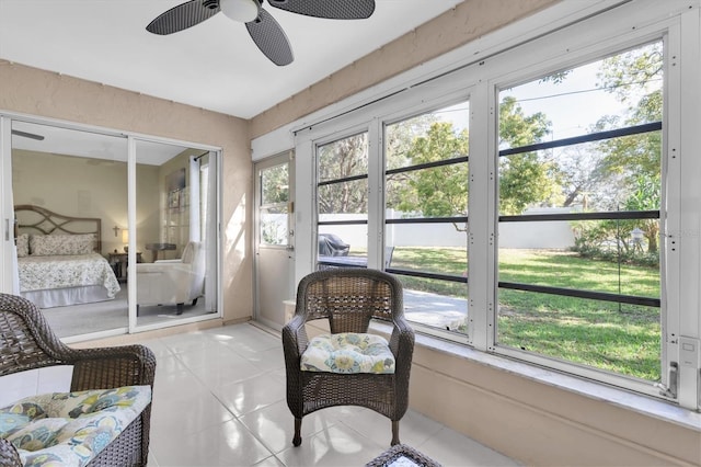 sunroom with a ceiling fan