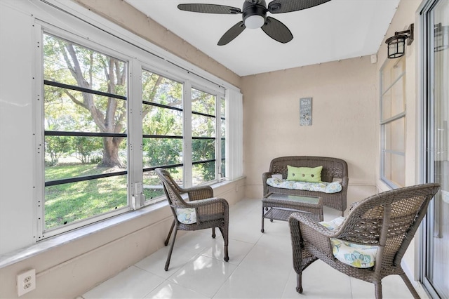 sunroom / solarium featuring plenty of natural light and ceiling fan