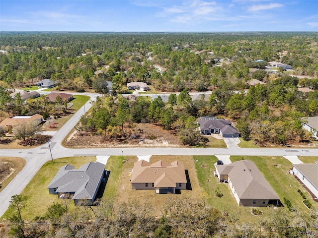 aerial view with a residential view and a wooded view