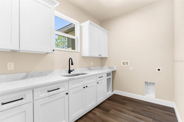 washroom with hookup for a washing machine, dark wood-style floors, cabinet space, electric dryer hookup, and a sink