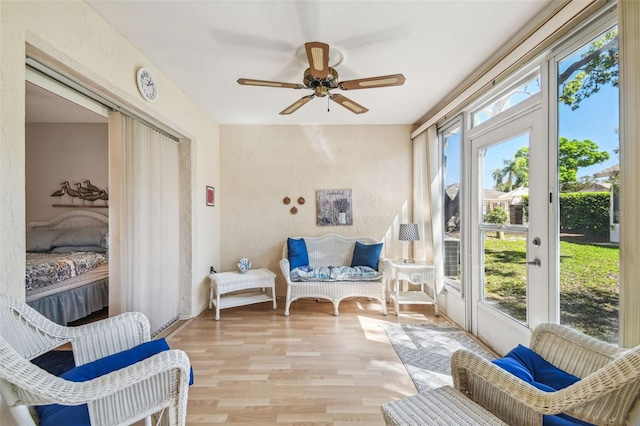 sunroom with a wealth of natural light and ceiling fan