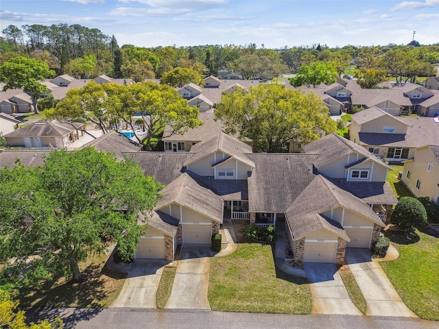 birds eye view of property with a residential view