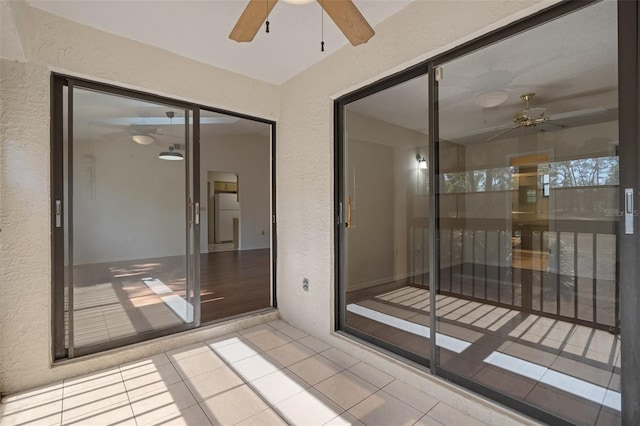 interior space with ceiling fan