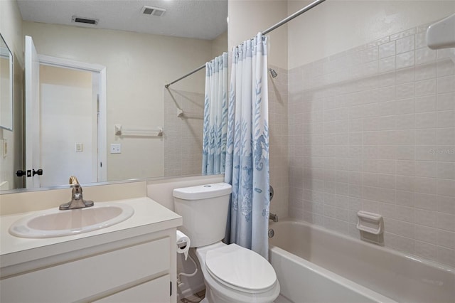 bathroom with visible vents, toilet, a textured ceiling, and shower / tub combo