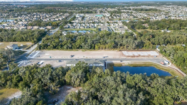 bird's eye view with a view of trees and a water view