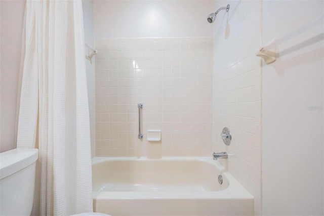 full bath with toilet and shower / bath combo with shower curtain