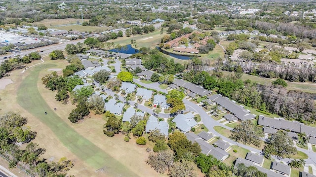 birds eye view of property featuring a residential view and a water view