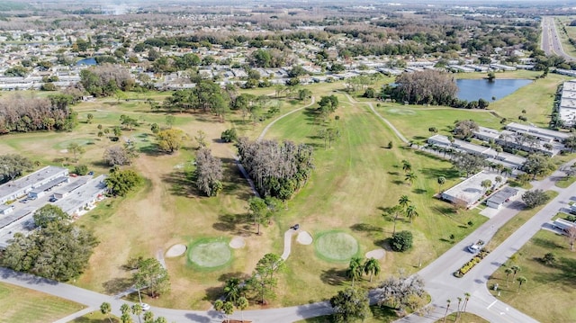 birds eye view of property featuring a water view and view of golf course