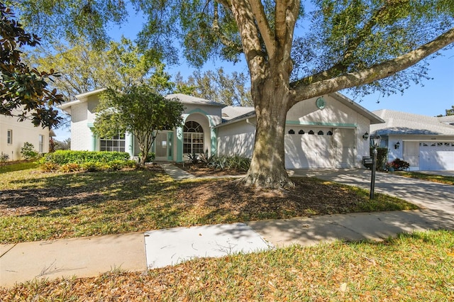 view of front of home featuring concrete driveway and a garage