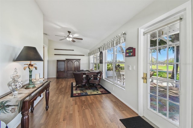 sunroom / solarium featuring vaulted ceiling and a ceiling fan