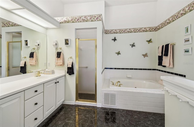 bathroom featuring visible vents, a shower stall, vanity, and a garden tub