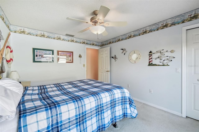 bedroom with visible vents, baseboards, light carpet, a textured ceiling, and a ceiling fan