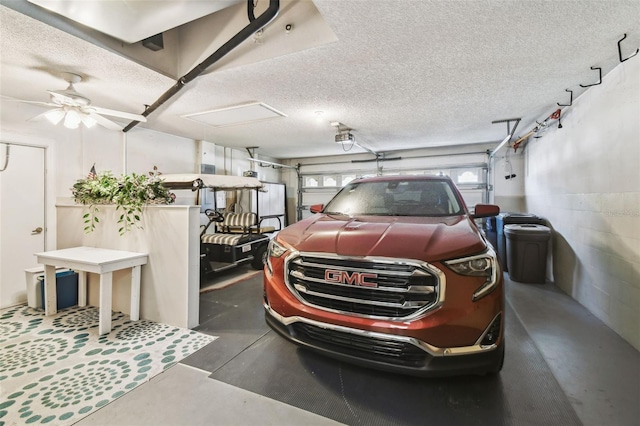 garage featuring concrete block wall and a garage door opener