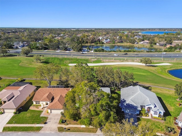 aerial view featuring golf course view and a water view