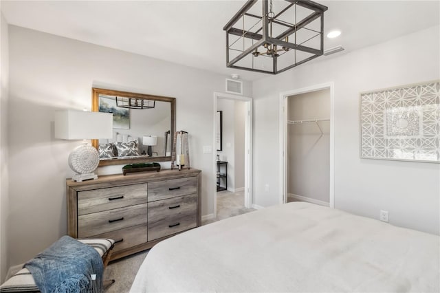 bedroom with a notable chandelier, baseboards, visible vents, and a closet