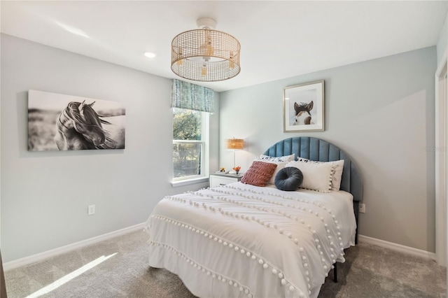 bedroom featuring baseboards and carpet flooring