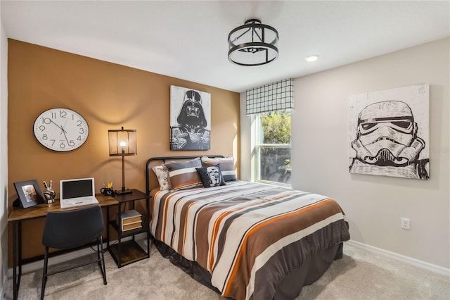 carpeted bedroom with baseboards