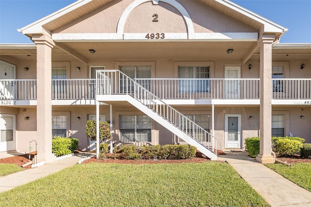 view of property featuring stairs