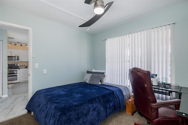 bedroom featuring visible vents, rail lighting, marble finish floor, a textured ceiling, and a ceiling fan