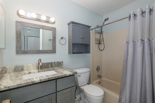 full bathroom with shower / tub combo, a textured ceiling, vanity, and toilet