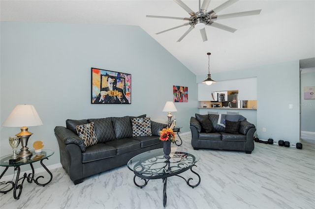 living area featuring baseboards, marble finish floor, and a ceiling fan