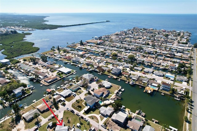 birds eye view of property with a residential view and a water view