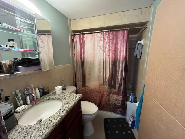 bathroom featuring toilet, vanity, tile walls, and a shower with shower curtain