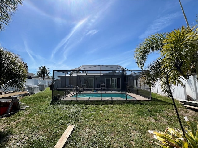 exterior space featuring a lanai, a fenced in pool, and a fenced backyard