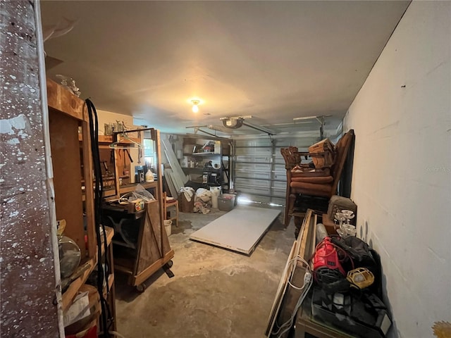 garage with concrete block wall and a garage door opener